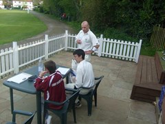 Mini Coops teaches Park how to score, all under the watchful eye of the skipper